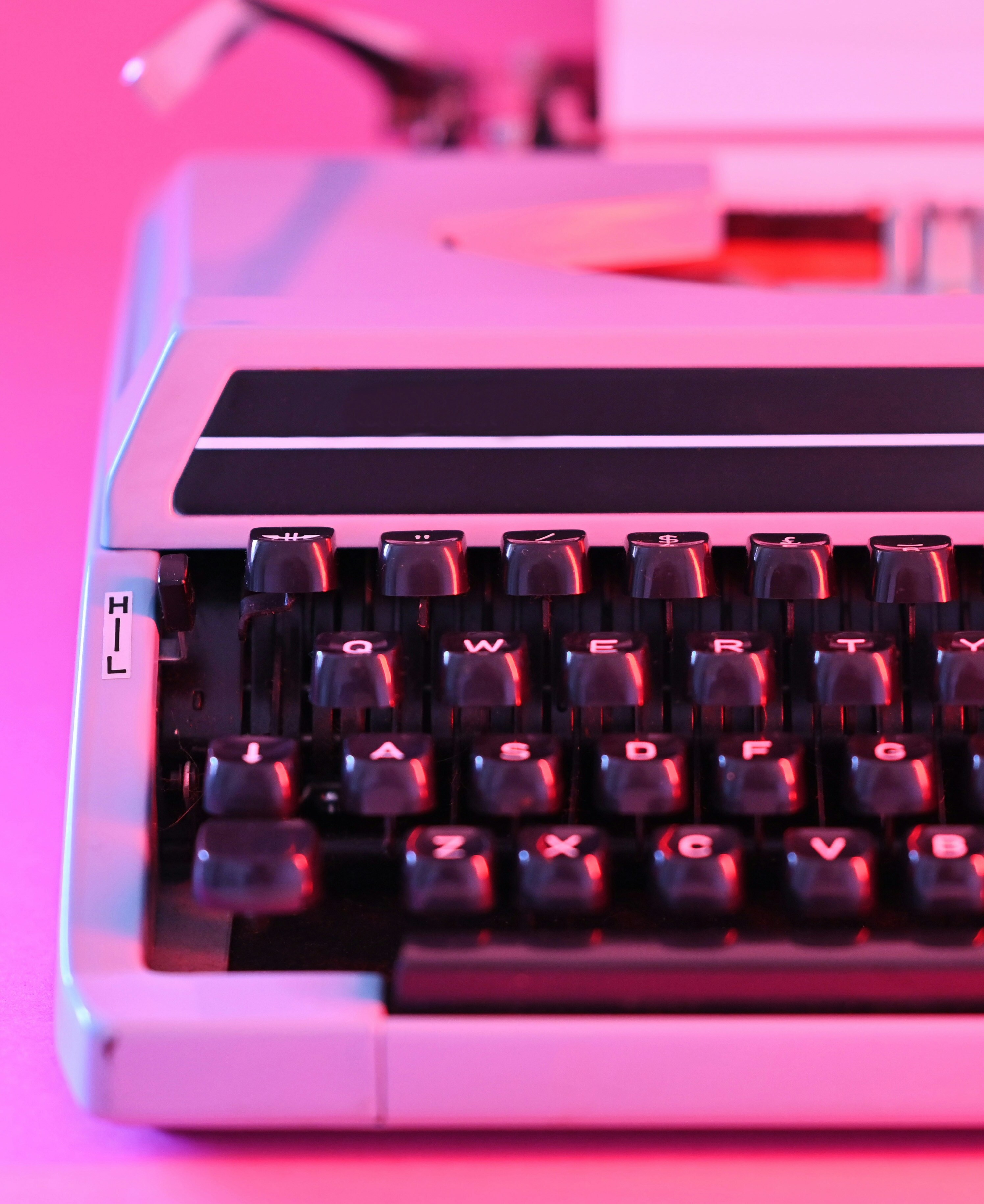 typewriter glowing in pink