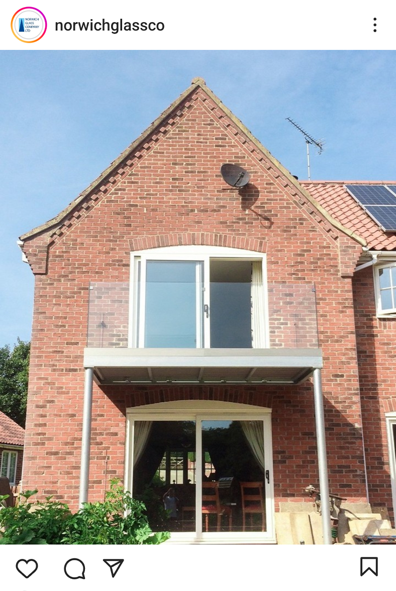 Social media graphic with photo of red brick home with large french windows and glass balcony